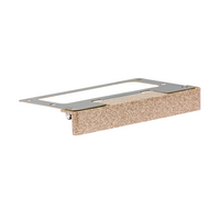 LF wall light in Desert Granite finish showing the compact under-cap mounting and subtle grazing light on a concrete cap and block wall.