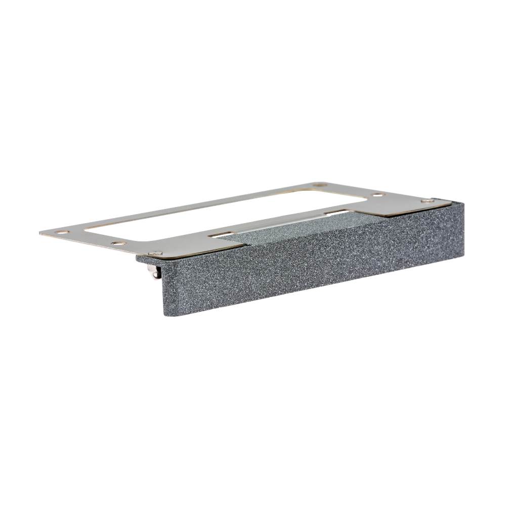 LF wall light in Weathered Iron finish, die-cast brass housing, low-profile under-cap design mounted on textured stone wall, front view.