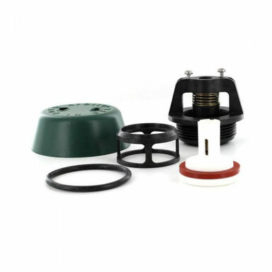 Top-half replacement kit for Apollo 1 in. PVB: poppet, bonnet, float cage, O-rings, canopy and lubricant, on white background.