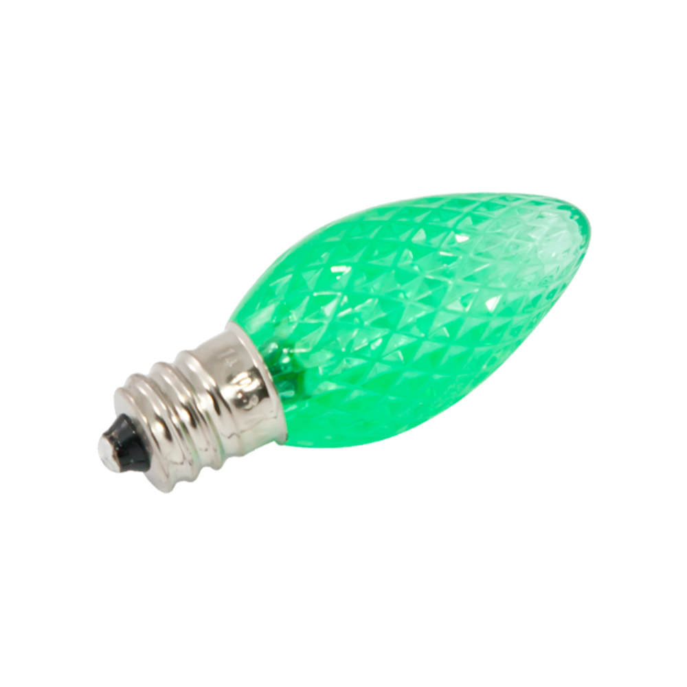 Green faceted C7 LED bulb with E12 candelabra base and polycarbonate lens; approx 2.09 in long, ideal for outdoor and decorative displays.