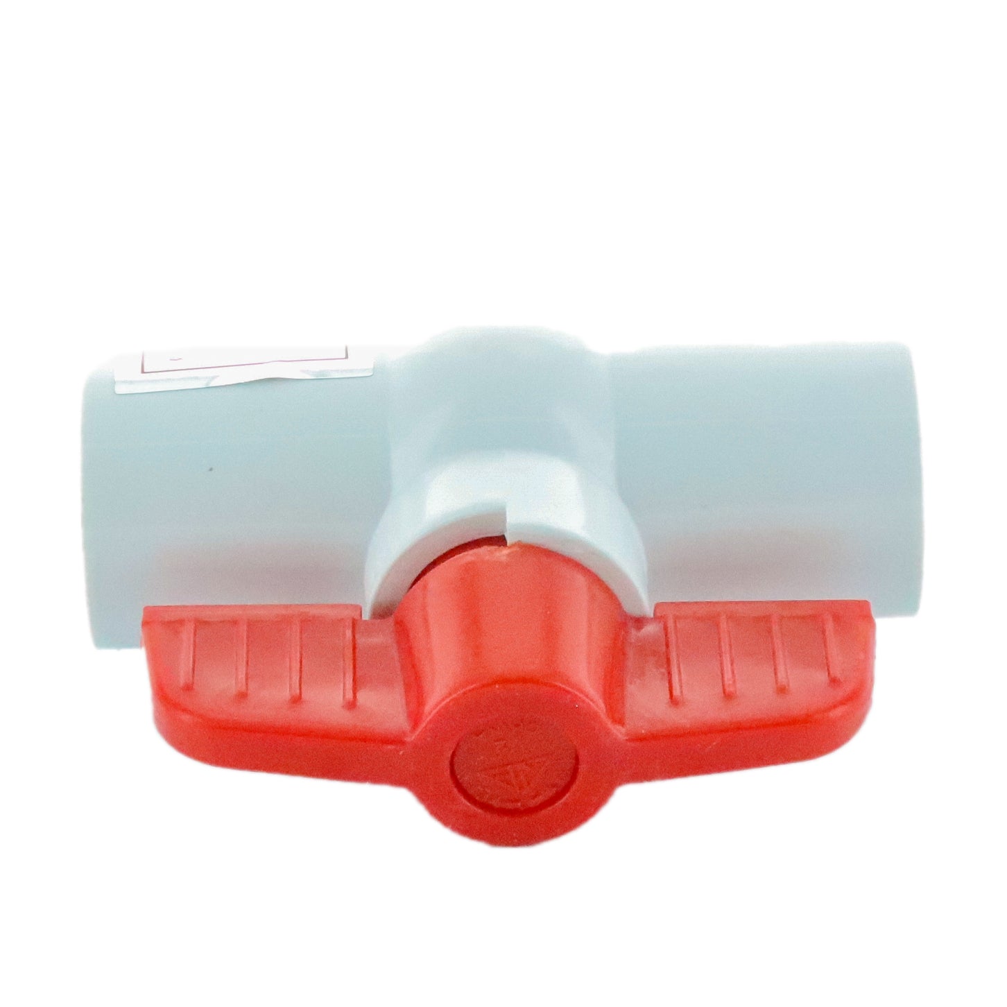 Angled view of 2-inch PVC molded-in-place ball valve highlighting slip ends, white PVC body and red handle actuator