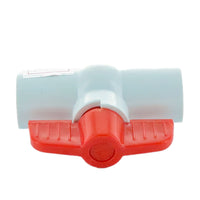 Angled view of 2-inch PVC molded-in-place ball valve highlighting slip ends, white PVC body and red handle actuator