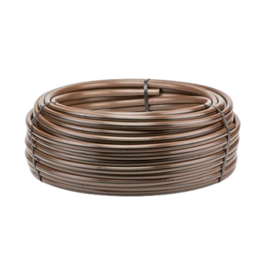Coiled HDL dripline roll showing dark brown tubing with black identification stripe, labeled 12-inch emitter spacing and smooth outer surface for installation.