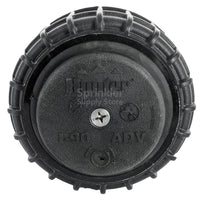 Front view of Hunter I-90-ADV 3-inch pop-up rotor installed in turf, showing the pop-up riser, nozzle openings, and low-profile rubber cover.