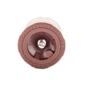 Angled side view of IPN-12TQ nozzle highlighting female-threaded base, brown cap, and compact fixed-arc spray design.