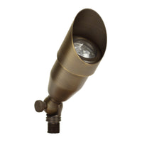 Unique Intrepid up light in weathered brass, rotatable shroud, sealed tempered glass lens and stake mount, without bulb.