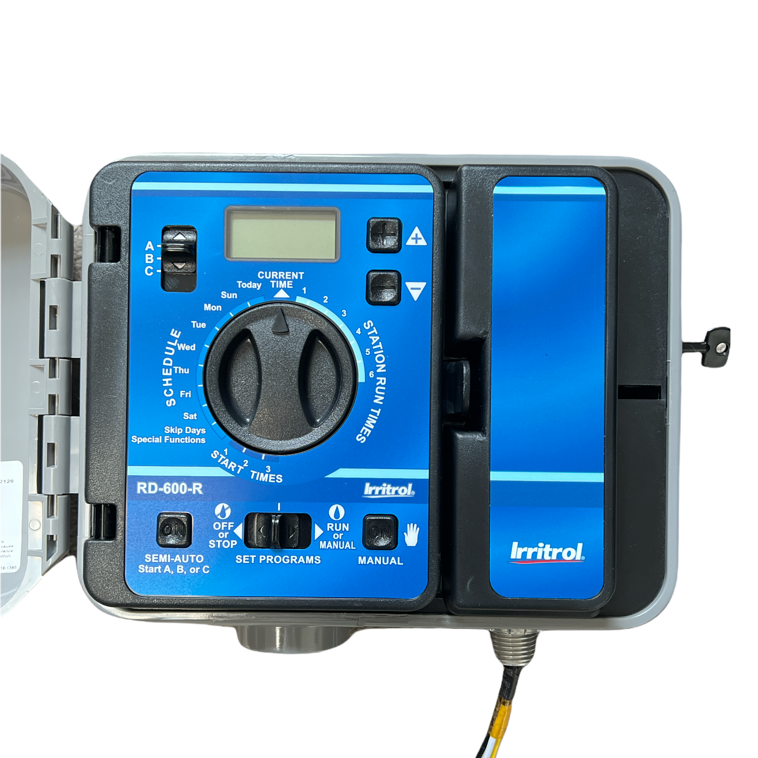 Irritrol RainDial-R RD1200-INT 12-station indoor irrigation controller, door open showing LCD display and control dial.