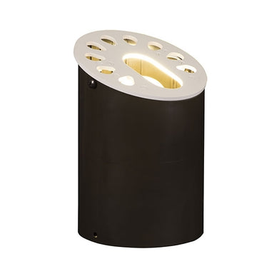 Bronze FX KG well light — low‑profile in‑grade fixture with metal flat top and 6‑LED module, shown installed flush with ground and aiming optics visible