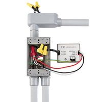 Angled view of FX LCMHV Luxor CUBE showing wiring terminals, compact housing, and mounting features for high-voltage installations.