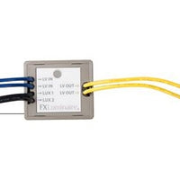 FX Luxor CUBE LCM-LV low-voltage zone/dimmer module, fully potted outdoor housing with wiring leads and label visible
