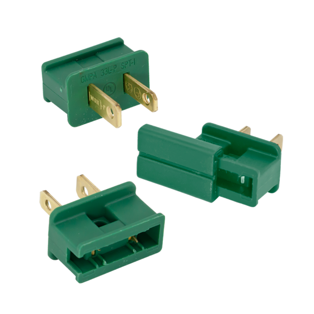 Green SPT-2 slide-on male plug (American Lighting), 2-prong polarized, 125V/10A — angled view of plug housing and prongs.