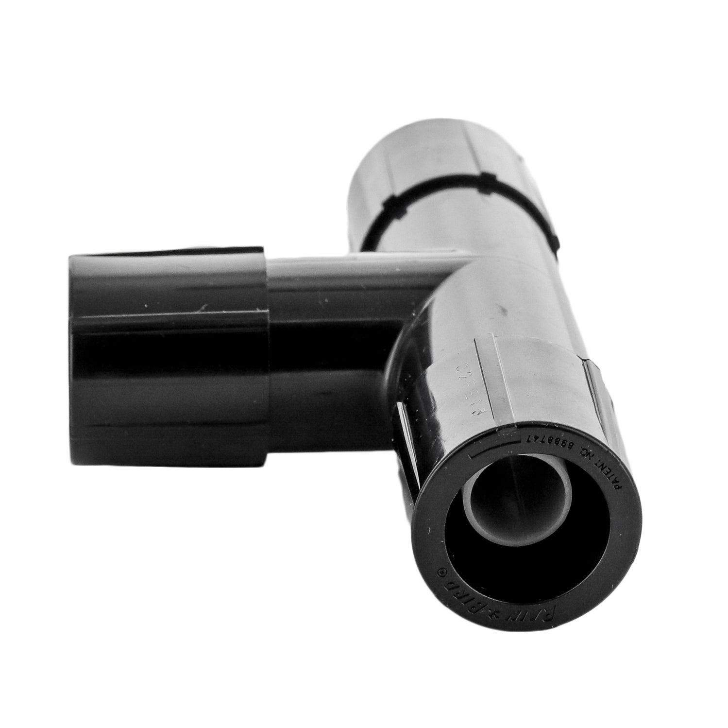Rain Bird MDCFTEE Easy Fit 1/2 in. tee assembled on 1/2 in. polyethylene tubing, showing removable flush cap and overall fitting profile.