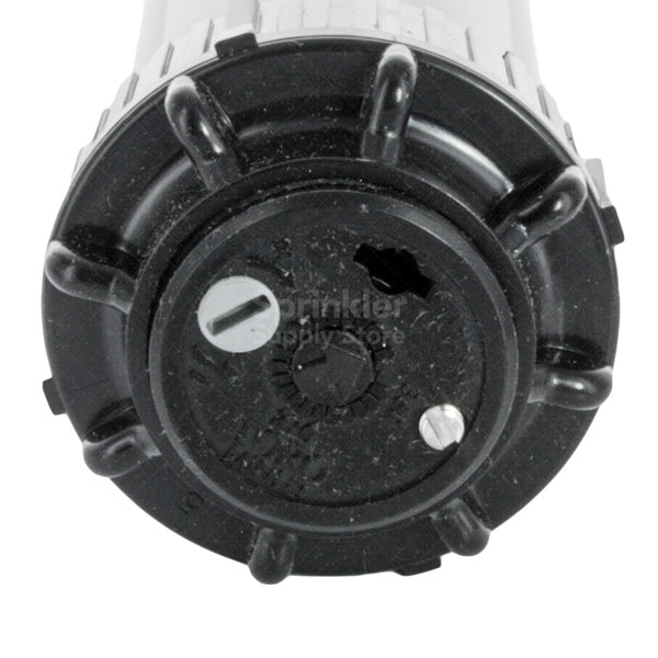 Side view of Toro Mini 8 MINI8-4P rotor installed in turf, highlighting the 4-inch pop-up height and exposed diameter with nozzle.
