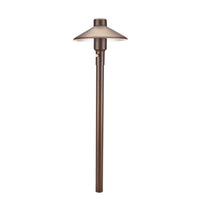 Weathered brass Mercury 7 low-voltage path light with frosted cylindrical lens mounted on a 12-inch riser and 25-foot lead.