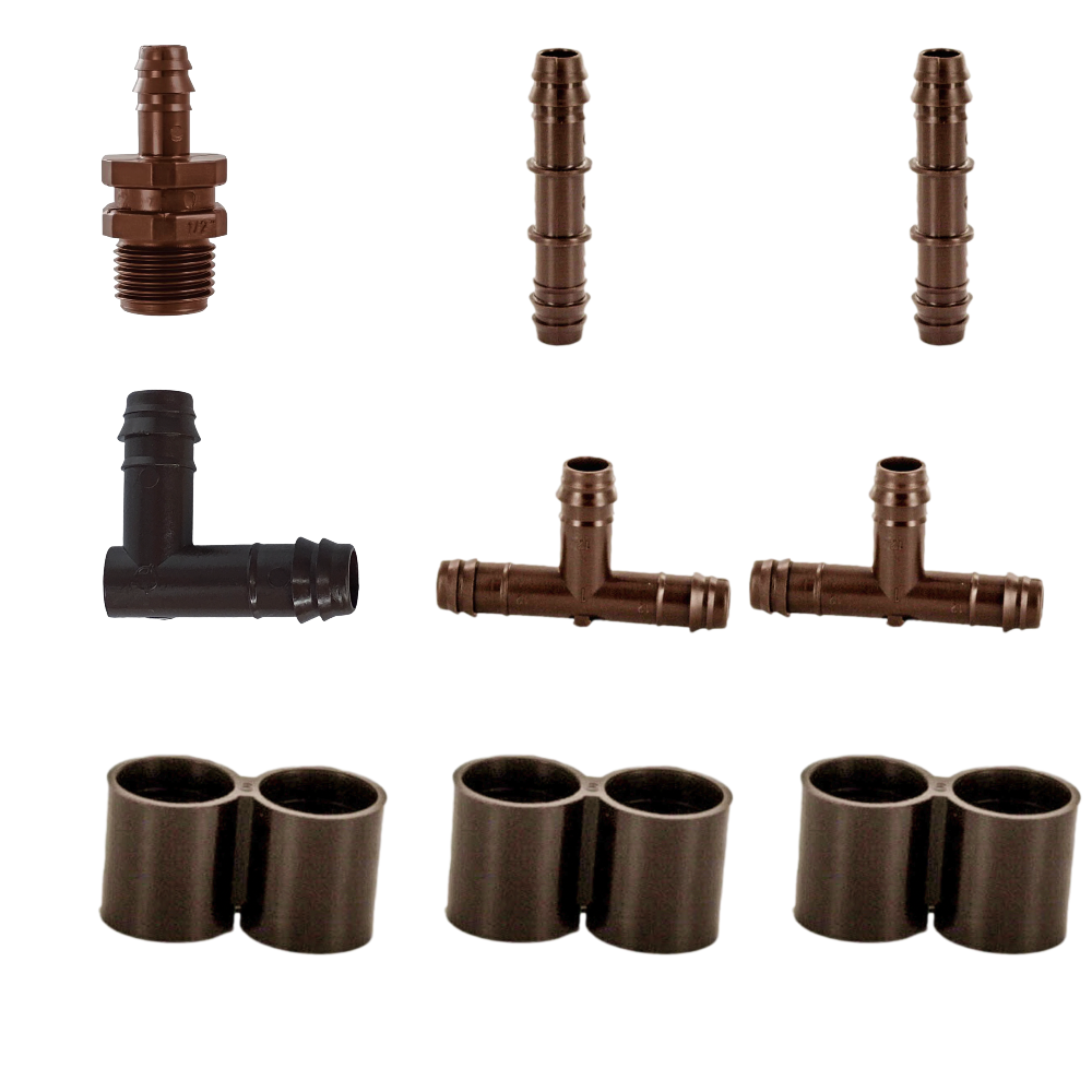 Overhead product shot showing Netafim 12mm Basic Drip Fitting Kit components laid out with T12COUP, T12ELL, T12FIG8, T12075MA and T12TEE visible.