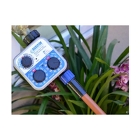 NDS A675CT 3-dial battery hose-end timer, front view showing dials and threaded garden-hose inlet/outlet.