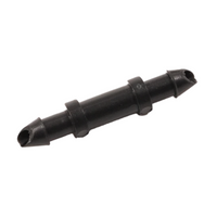 Black NDS C250 1/4-inch insert barb connector for drip irrigation; single plastic barbed fitting on white background