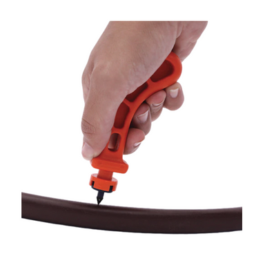 Close-up of Netafim SPDT insertion tool showing handle grip, insertion tip, and the engineered geometry for self-piercing dripper installation.