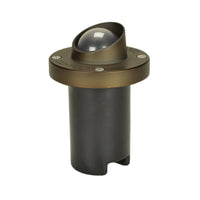 Unique Nova in-ground well light shroud in weathered brass finish, round die-cast brass top and recessed lens, no lamp shown.