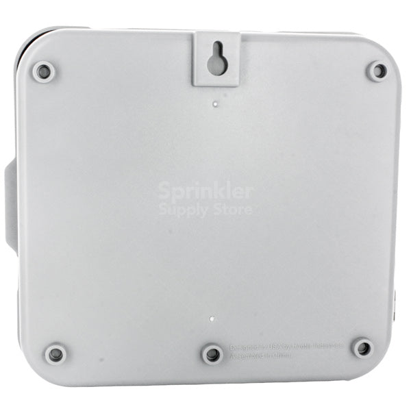 Hunter Pro-C PC-400i mounted on wall inside cabinet; compact 9 x 10 x 4.5 inch indoor enclosure with accessible wiring and transformer cord.
