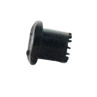 Close-up of the diffuser cap's underside and outlet that directs water to the root zone while preventing washout and splatter.