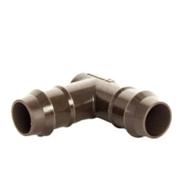 Close-up of PLDELB 17mm barb elbow showing barb detail and connection profile suitable for PLD dripline, brown finish.