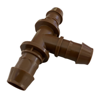 Side view of Rain Bird XFF-TEE 17mm barb tee illustrating durable, break-resistant plastic construction and discreet earth-tone finish.