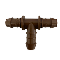 Scale comparison of XFF-TEE 17mm barb tee next to 17mm OD tubing, showing insertion fit and compatibility with XF Series dripline.