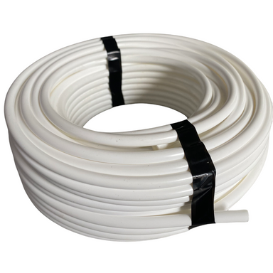 Netafim white polyethylene micro drip tubing coiled on a plain background, showing the full 100 ft roll and smooth outer surface.