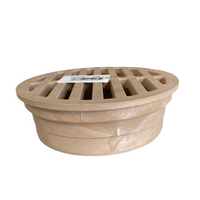NDS 13S 4-inch sand round grate installed in a display showing fitment to a 4-inch drain and flat top surface.