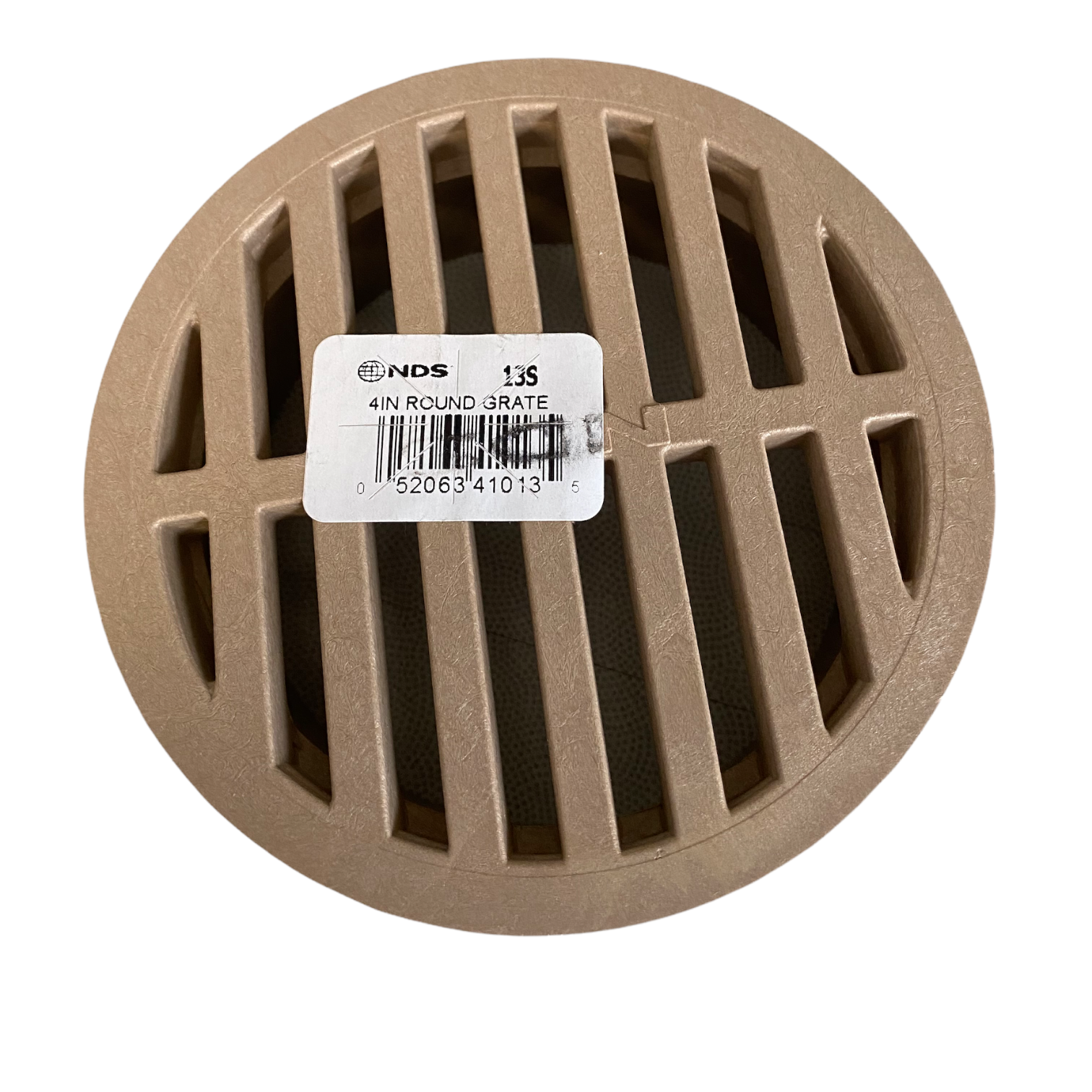 Top-down view of NDS 13S 4-inch sand-colored round drain grate showing slotted pattern and flat profile for surface drainage.