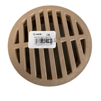 Top-down view of NDS 13S 4-inch sand-colored round drain grate showing slotted pattern and flat profile for surface drainage.