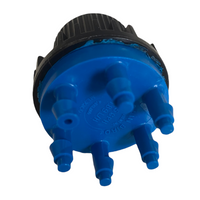 Side and rear angle of Rain Bird XBT056 6-outlet shrub emitter in blue, highlighting outlet port arrangement and housing details for identification.