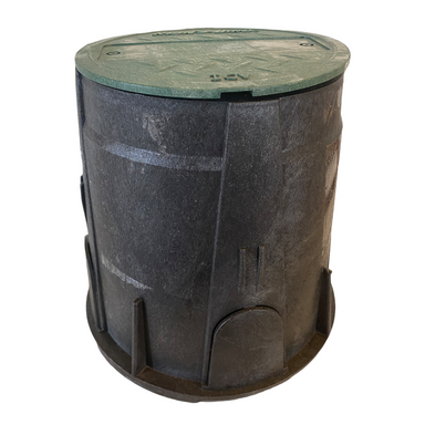 Top-down view of Rain Bird VB7RND with green snap-fit lid in place, illustrating smooth lid surface and beveled edges to resist mower damage.