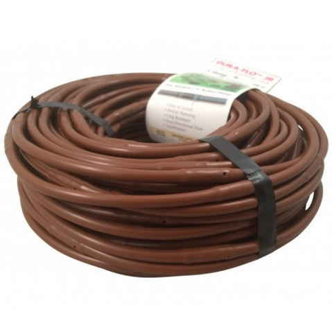 Angled view of NDS 1/4 in Dura Flo Jr dripline roll with visible emitters and brown polyethylene tubing.