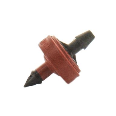 Close-up of Netafim SPCV20-25 red self-piercing pressure‑compensating emitter showing barb inlet and discharge outlet for micro‑irrigation tubing.