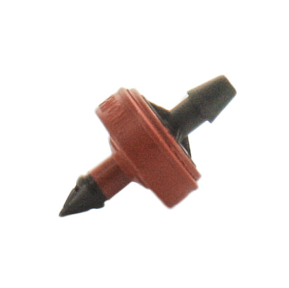 Close-up of Netafim SPCV20-25 red self-piercing pressure‑compensating emitter showing barb inlet and discharge outlet for micro‑irrigation tubing.