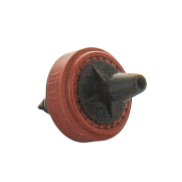 Side view of red Netafim SPCV20-25 emitter highlighting TurboNet flow path housing and compact profile for container and hanging basket use.