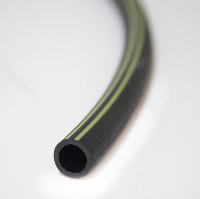 Pro-Trade swing pipe uncoiled detail showing flexible, kink-resistant 1/2-inch tubing used for underground sprinkler head and rotor hookups.