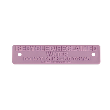 Purple rectangular valve box nameplate, 5.75 x 1.25 inches, printed 'RECYCLED / RECLAIMED WATER DO NOT DRINK - NO TOMAR', with two rivet holes for tamper-proof mounting.