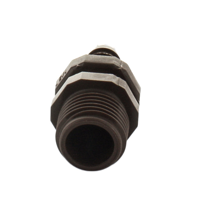 Netafim T12050MA 12mm x 1/2" male adapter placed next to 12mm dripline to illustrate fit, barbed insert, and compact one-piece design.