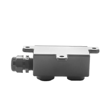 Side angle of FX TBBZ tree-mount junction box in bronze finish, highlighting stainless-steel hanger bolts and the strain-relief connector for wiring.