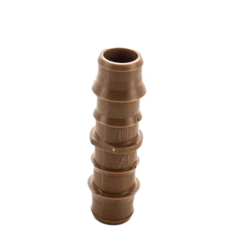 Close-up detail of Netafim TLCOUP coupling end highlighting barbed ridges and brown UV-resistant polyethylene surface texture for outdoor use.