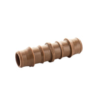 Angled product view of 17mm Netafim insert coupling illustrating one-piece construction and barbed connection points for quick push-in joins.