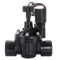 Front three-quarter view of Toro TPV TPVF100DC 1-inch female x female globe valve with integrated flow control and 12V DC latching solenoid assembly, black polymer body, shown on white background.