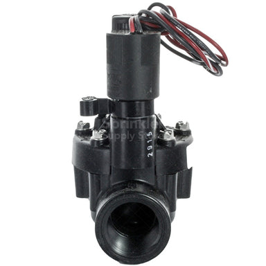 Close-up of the Toro TPVF100DC valve showing flow control screw, solenoid mounting, and DBS debris-bypass area — 1-inch female threaded connections, black polymer construction.