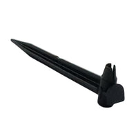 Front view of Rain Bird TS025 1/4-inch tubing stake showing flat enlarged head and pointed shaft for securing drip tubing into soil, angled on white background.