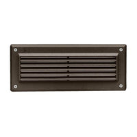Kichler 15073AZT louvered brick light in textured architectural bronze showing cast-aluminum faceplate and white lens