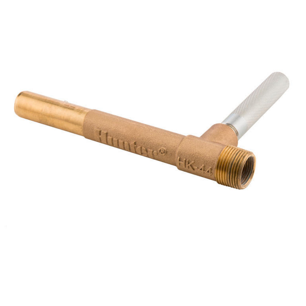 Close-up of Hunter HK-44 quick coupler key showing 1" stainless lug inlet and 1" male / 3/4" female outlet.