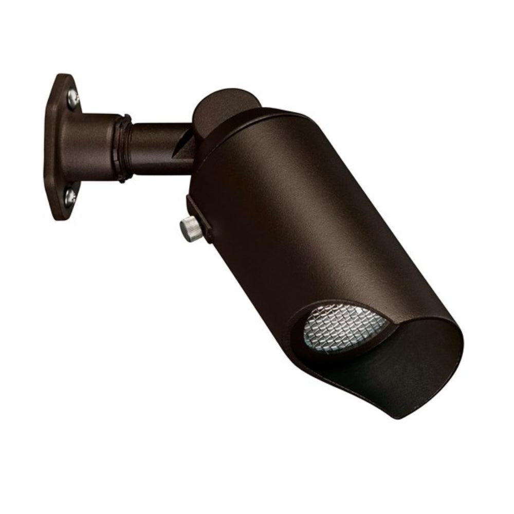 Kichler 15087AZT low-voltage architectural bronze landscape downlight with bi-pin socket and stainless steel guard, shown mounted for accent lighting.